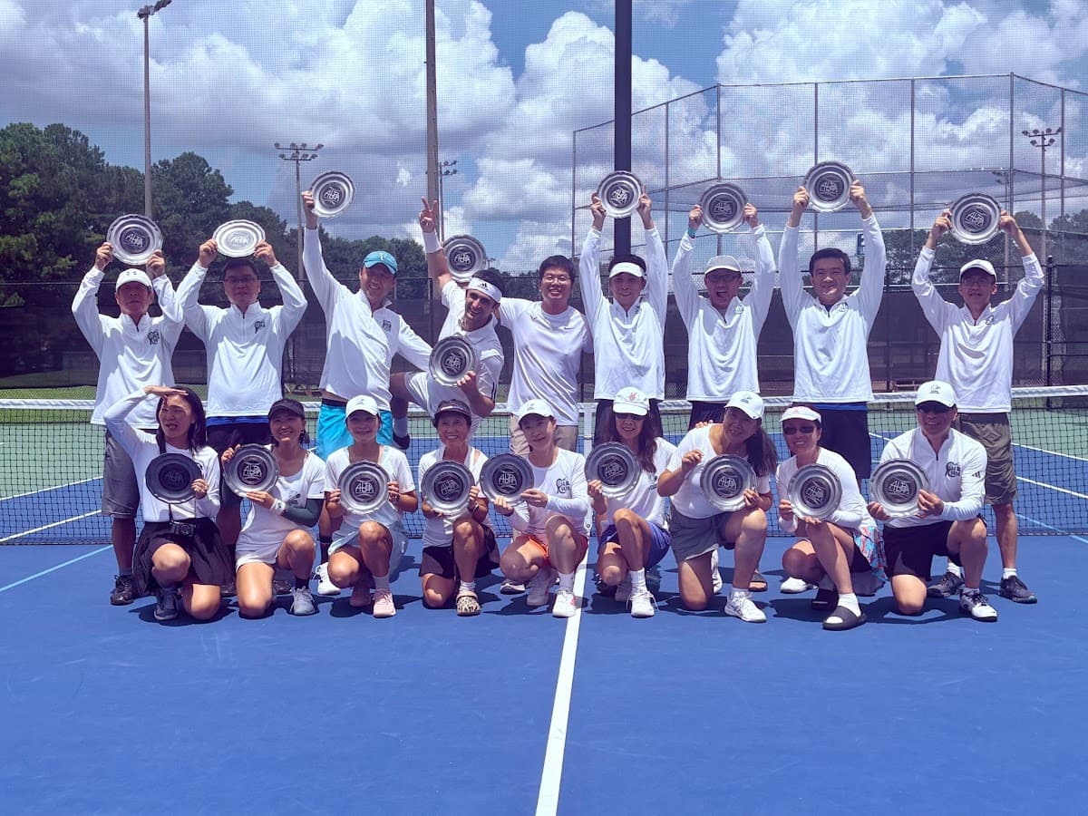 Players gathered courtside at the Atlanta Chinese Tennis Championship